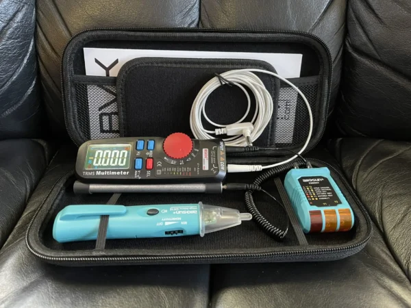 A black case with various electronics and cords in it.